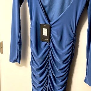 Blue long sleeve open back dress